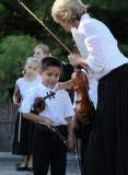 Suzuki orchestra preparing to go on stage